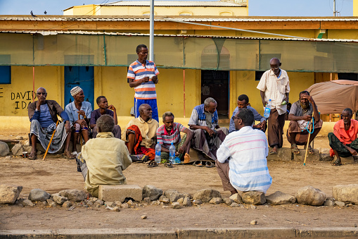 Group of men socialize in the outskirts of Djibouti City, Djibouti.
