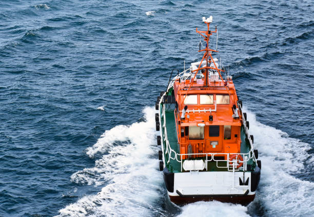 istock An orange pilot boat is sailing at high speed 1094552990