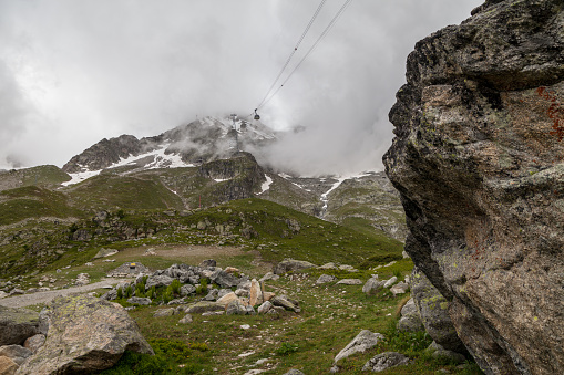 View to the Mont Blanc in cloudy time from cableway skyway station in Courmayeur, Italy.