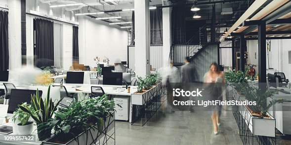 istock modern open space office interior with blurred business colleagues 1094557422