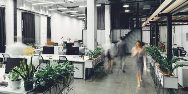 modern open space office interior with blurred business colleagues - inside of office technology people imagens e fotografias de stock