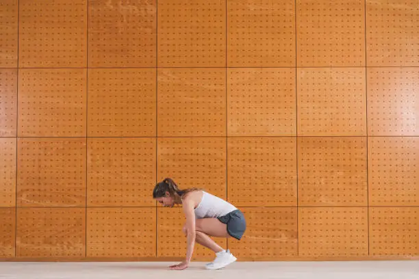 Fit beautiful young woman and man demonstrating bodyweight exercises you can do at home or anywhere with no equipment. Professional fitness trainer showing the correct way of performing an exercise. You can do this simple exercises at your home, every day and improving our physical abilities. Before working out, it’s important to warm up the body with a little cardio routine, always making sure to work out as intensely as our body allows us and taking a break when you need one. During the exercise you must stay hydrated and after making sure you stretch your muscles. All the steps of the proper workout.