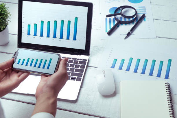istock Graphs and charts elements on laptop computer screen  and statistical performance of the company in the past year. 1094563348
