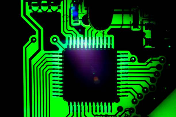 istock Macro closeup of green circuit board through light 1094563604