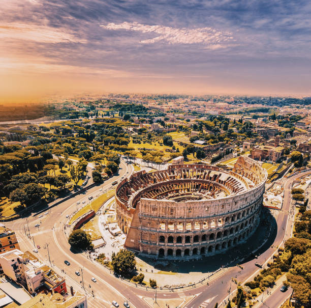 colosseum in rome and morning sun, italy - rome imagens e fotografias de stock