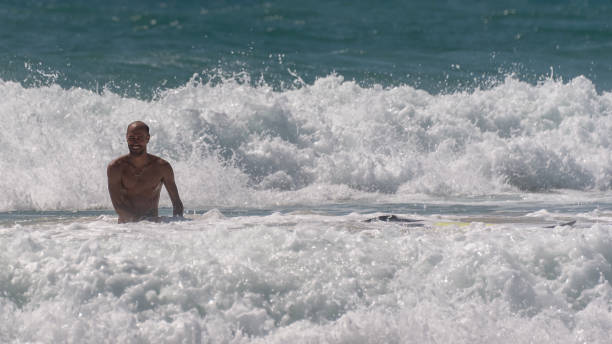Maceio, Alagoas, Brazil - January 02, 2018:Beach with crystal clear waters and strong waves, perfect for surfing.
