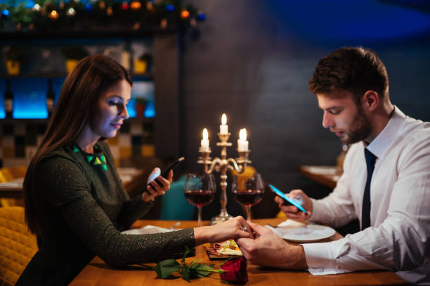 istock Couple holding hands and texting on the smart phone 1094571762