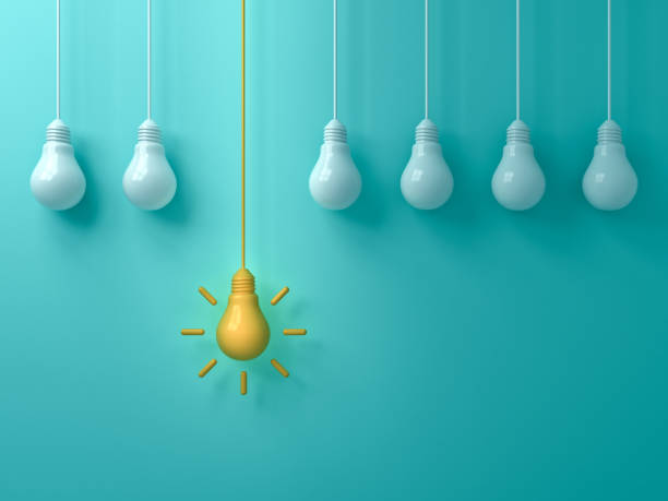 istock Think different concept One hanging  yellow idea light bulb standing out from white unlit bulbs on blue green pastel color background leadership and individuality creative idea concepts 3D rendering 1094574322