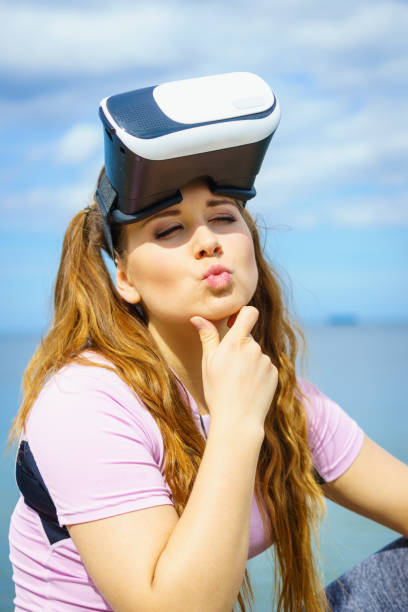 istock Woman wearing VR outside 1094575068