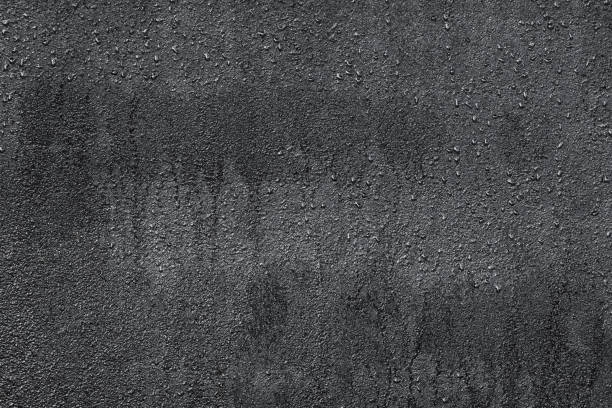 istock wet asphalt, water drops on asphalt 1094575542