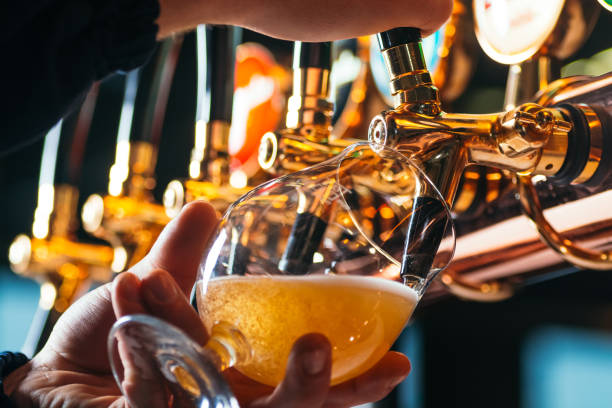 istock Hand of bartender pouring a lager beer in tap 1094576144