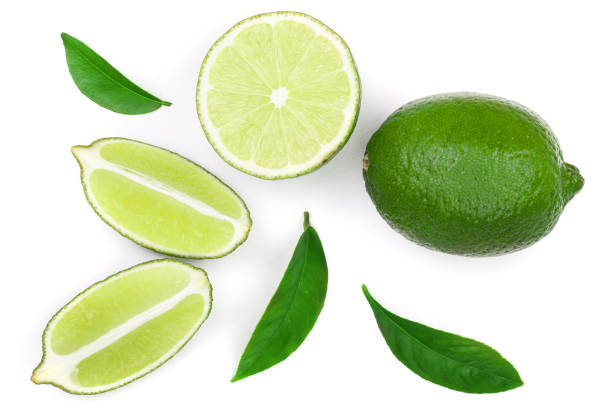 istock sliced lime with leaves isolated on white background. Top view. Flat lay pattern 1094578692