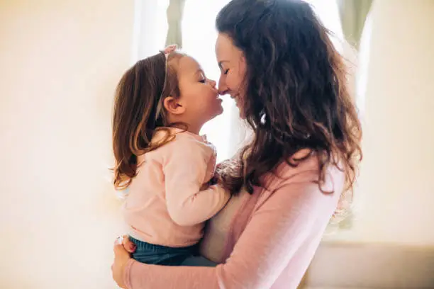 Mother hug her daughter in home