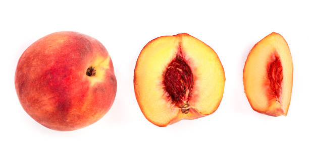 istock ripe peaches and half isolated on white background. Top view. Flat lay pattern 1094583994
