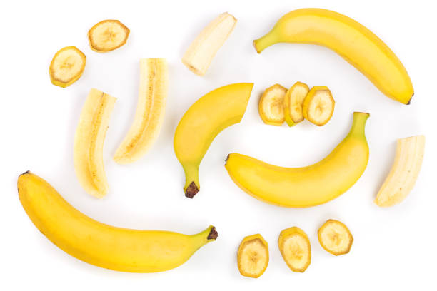 istock whole and sliced bananas isolated on white background. Top view. Flat lay 1094584052