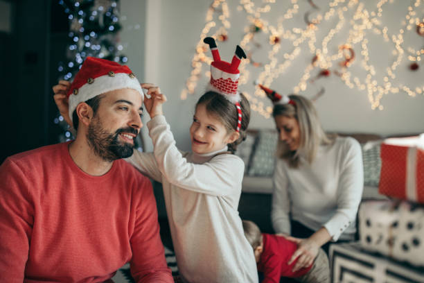 istock Daughter playing with father during Christmas 1094590022