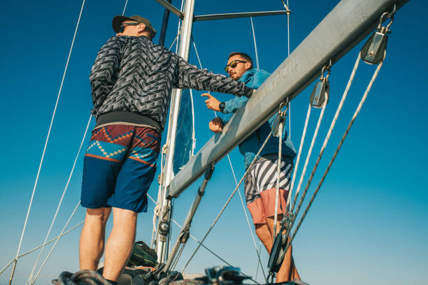 istock Two men on yacht against clear sky,Croatia 1094597376