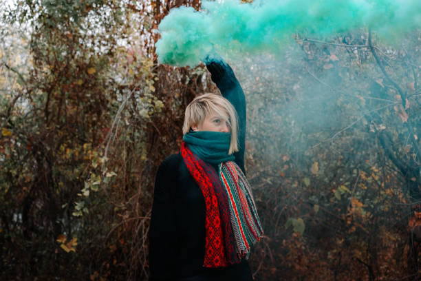 istock Woman With Distress Flare Standing On Field 1094597826