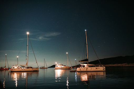 Night sky over moored boats