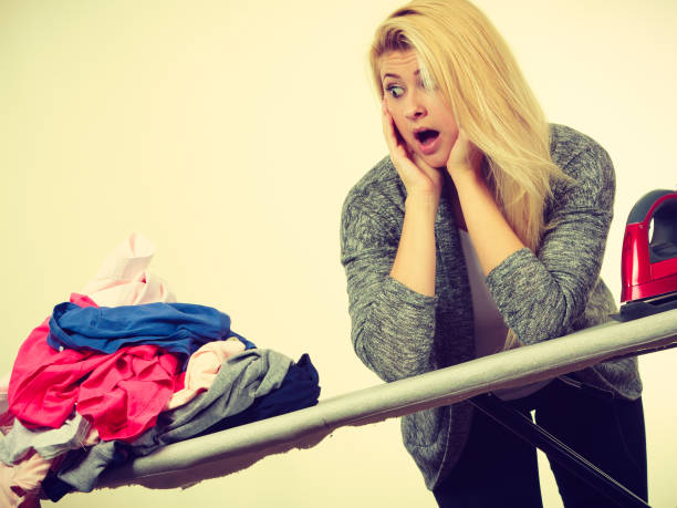 istock Woman having enough of ironing clothes 1094598112