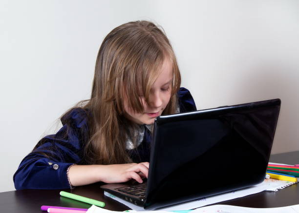 istock Cute Girl Using Laptop At Table Against White Background 1094598462