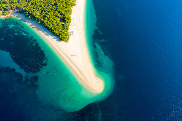 Aerial view of beach on peninsula in Croatia, Bol, Zlatni rat Aerial view of beach on peninsula in Croatia brac island stock pictures, royalty-free photos & images