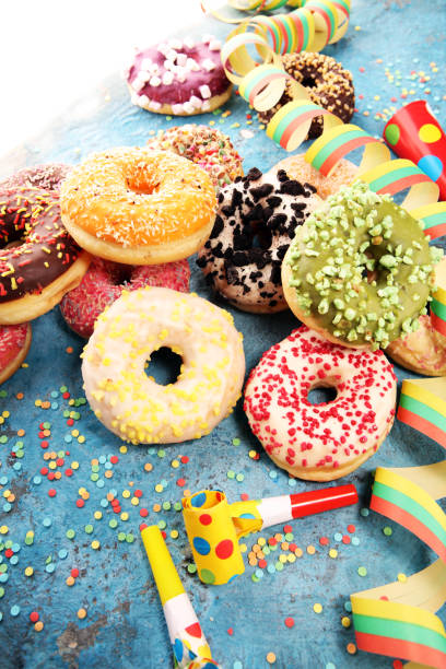 istock assorted donuts with chocolate frosted, pink glazed and sprinkles donuts 1094605012