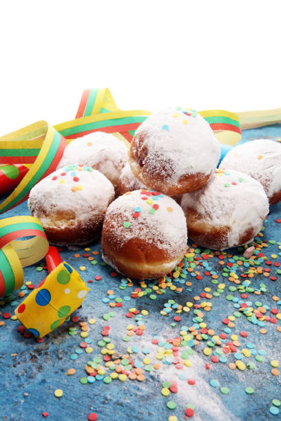 istock German donuts with jam and icing sugar. Carnival powdered sugar raised donuts 1094607036