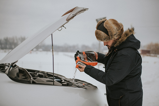 man preparing your car for winter