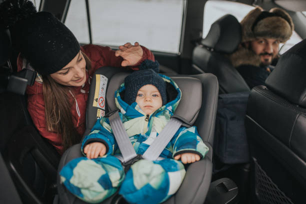 istock a young married couple with a child cares about safe driving 1094610242