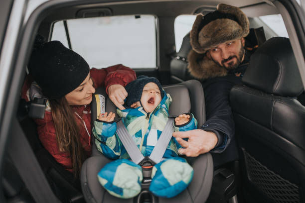 istock a young married couple with a child cares about safe driving 1094610596