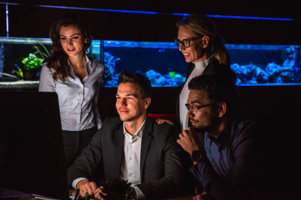 istock Group of people working late at office 1094611358