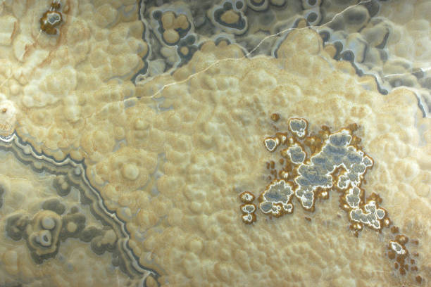istock Background from a light yellow natural stone Onyx with bubbles and gray stains on the surface is called onix naranja veteado 1094615884