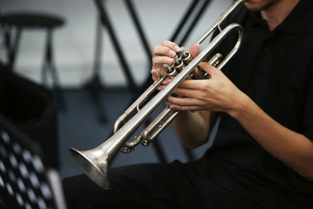istock A man playing a trumpet during a live performance. 1094620610
