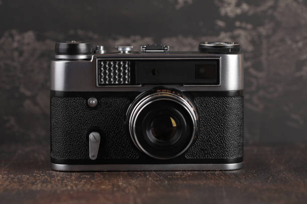 istock The old rangefinder camera on a brown cement background. 1094621600
