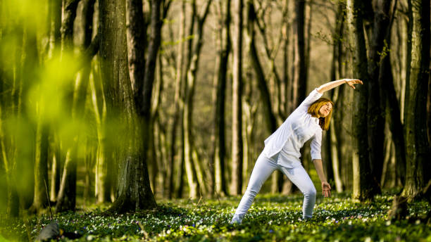 istock Woman exercising in forest 1094622786
