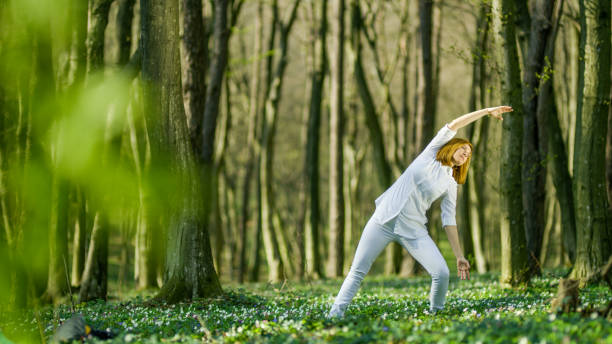 istock Woman exercising in forest 1094623032