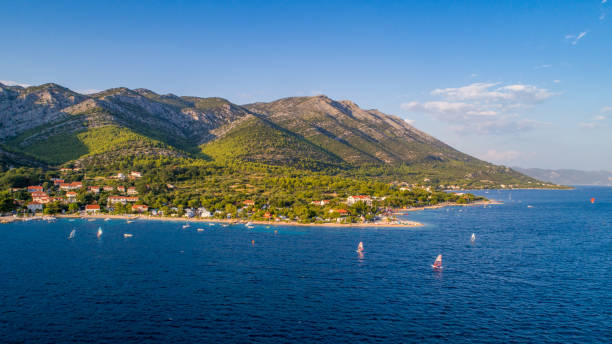 istock Green hills towering over tranquil sea,Peljesac 1094623854