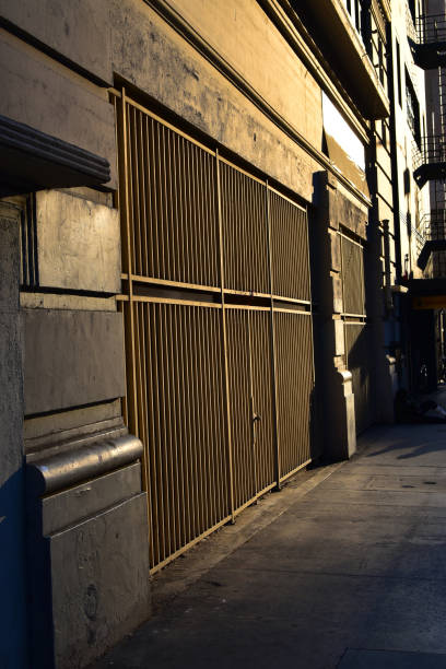 istock Golden sunset street with security gate 1094625950