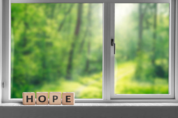 istock Hope sign in a window sill with a view 1094629646