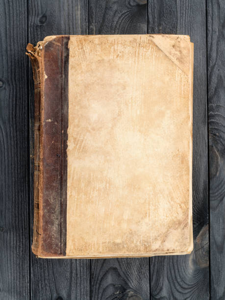 istock Old book with blank cover on the wooden table 1094631494