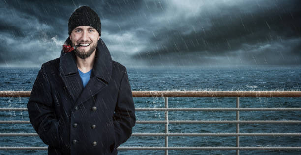 istock Attractive seafarer on his ship in bad weather 1094631814