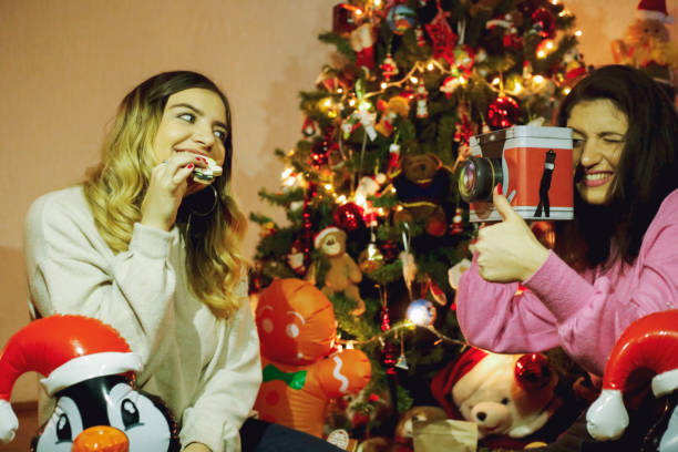 istock Two happy girls near Christmas tree 1094632154