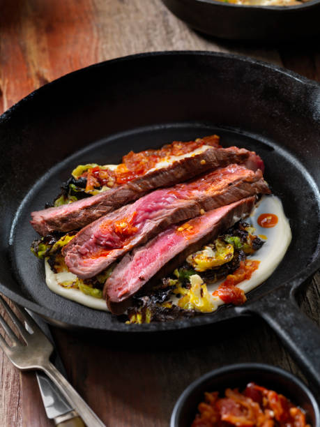 istock Medium Rare Flank Steak with Roasted Brussels Sprouts and Chili Oil 1094636816