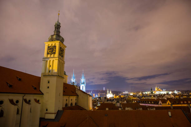 View of tower with clock on city under clouds,Prague