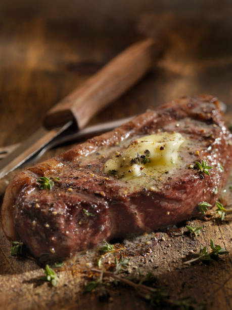 istock Medium Rare Top Sirloin Steak with Herb Garlic Butter 1094641624
