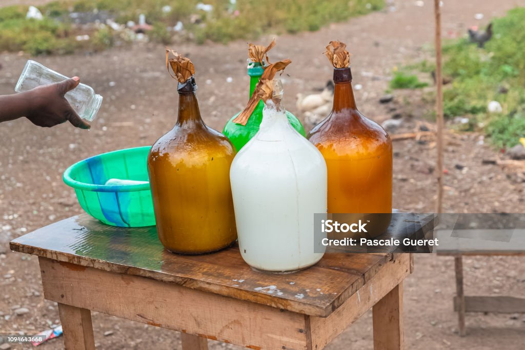 Palm wine in bottles Palm wine in bottles sold in a village, Sao Tome and Principe Wine Stock Photo