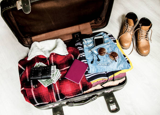 istock Travel concept open suitcase with casual clothes 1094643872