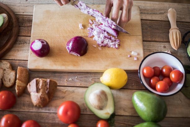 istock Guacamole making, red onions chopping 1094644176