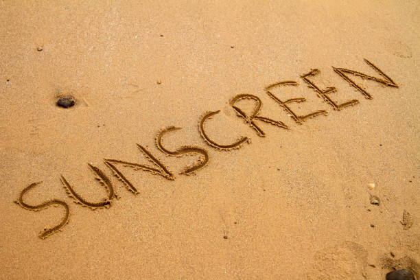 istock The word sunscreen drawn in sand 1094647270